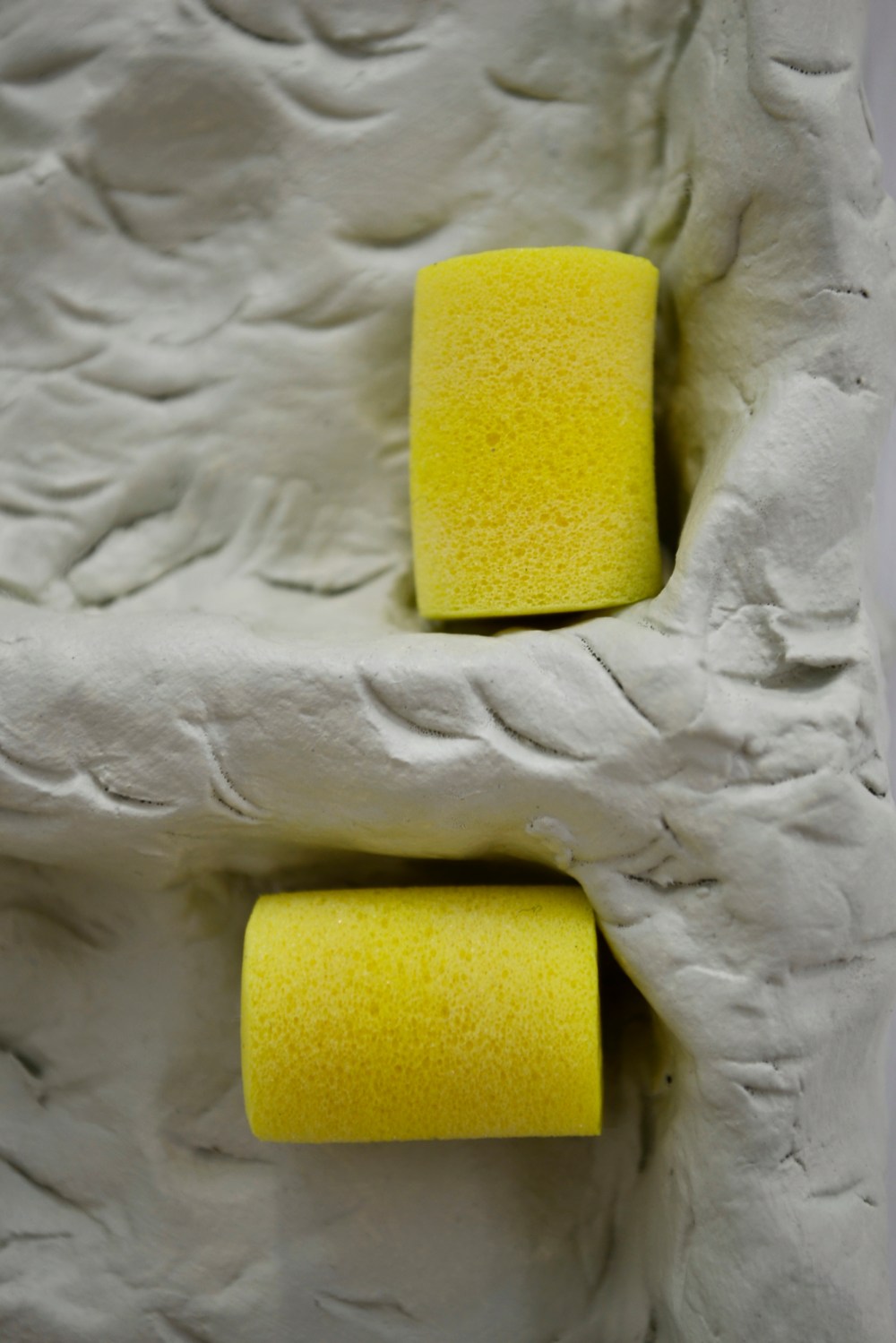 44 - Agnes Calf, Double Rotation (Earplugs), 2013, Clay, Acrylic Paint, Varnish, Foam Earplugs, 15 x 27 x 2.5cm (detail) copy